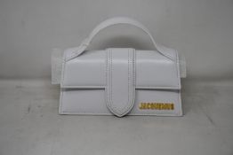 An as new Jaquemus Le Bambino bag in white (RRP £380).