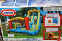A Little Tikes Giant Slide Bouncer.