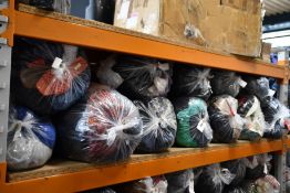 Twelve bags of assorted pre-owned clothing and related items.