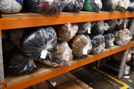 Twelve bags of assorted pre-owned clothing and related items.