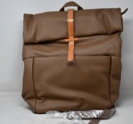 Two as new Monk & Anna Herb backpacks in cacao.