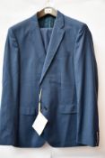 An as new Tommy Hilfiger suit in blue (EU 52).