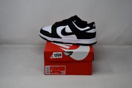 A pair of as new Nike Dunk Low Retro (UK 7.5).