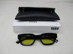 A pair of as new Akila Zed sunglasses with yellow lenses.