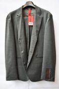 An as new Hugo Boss packable slim fit suit in dark grey (UK 48).