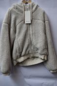 An as new LuluLemon reversible fleece jacket (Size 10, mark on left sleeve, requires washing -