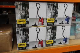 Four new Zanussi Easy Go ll 3L, 700W, 7.5M radius retractable cord vacuum cleaners (2 x red, 2 x