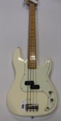 A Fender Precision Bass in white.