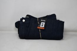 A pair of as new Hugo Boss jeans and a pair of Hugo Boss Schino-Regular trousers (W36/L30).
