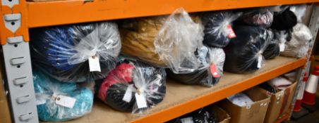 Twelve bags of assorted pre-owned clothing and related items.