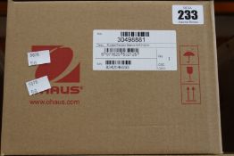A boxed as new Ohaus Portable Precision Balance NVE2102UK.