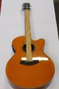A Yamaha CPX600 Vintage Tint electro acoustic guitar.