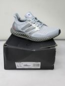 A pair of as new Adidas Ultra4D (UK 6.5).