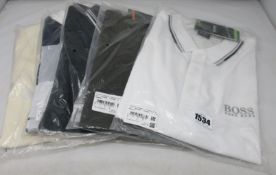 Five assorted as new Hugo Boss polo shirts (3 x L, 2 x XL).