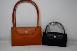 Three as new Longchamp bags.