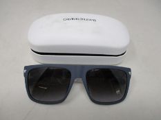 A pair of as new Calvin Klein sunglasses.
