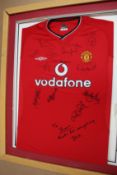 A pre-owned 2000/2002 Man United football shirt signed by various team members to include Alex