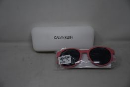 A pair of as new Calvin Klein sunglasses.