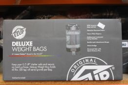 A set of four as new E-Z Up Deluxe Weight Bags (WB3GYBK4).