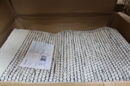 A Benuta Rocco hand woven rug in beige and black (170 x 240).