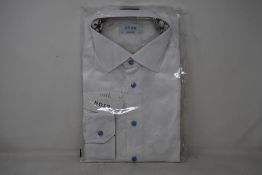 An as new Eton shirt in white (Size 17 - RRP £170).