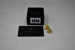 A pair of as new Versace Medusa Head earrings (Gold ton brass).