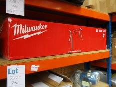 A boxed as new Milwaukee MSL 1000 folding mitre saw stand.
