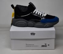 A pair of as new Moschino Couture MB15103 sneakers (EU 43).