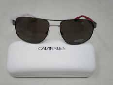 A pair of as new Calvin Klein sunglasses.