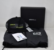 An as new Emporio Armani tracksuit (S), polo shirt (XL) and baseball cap.