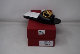 A pair of as new Valentino leather slides (EU 37 - RRP £380).