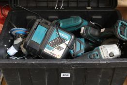 A toolbox containing seven pre-owned Makita power tools with batteries, chargers and accessories (
