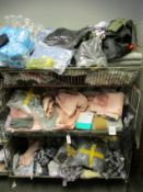 A quantity of assorted as new clothing and related items.