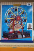 A boxed as new Lemax - The Giant Wheel.