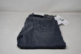 A pair of women's as new 7 For All Mankind The Skinny jeans with Swarovski crystals (Size 29).