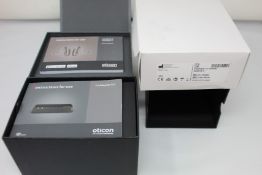 A pair of boxed as new Oticon More 1 Minirite R hearing aids with left and right speaker units, a
