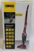 Three new Zanussi Red Handy Go 2 in 1, 95W, 0.55L rechargeable cordless vacuum cleaners (ZANDX75).