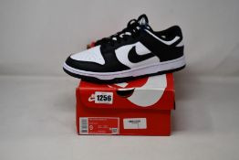 A pair of as new Nike Dunk Low Retro (UK 8).