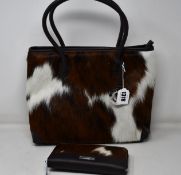 An as new Hyde & Hare cowhide handbag with matching purse.