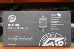 A set of four as new E-Z Up Deluxe Weight Bags (WB3GYBK4).