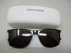 A pair of as new Calvin Klein sunglasses.
