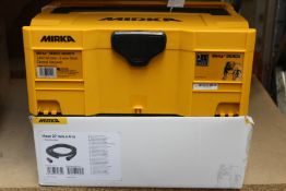 A MIRKA DEROS 5650CV Direct Electric Random Orbital Sander with accessories.