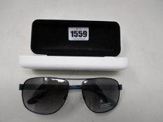 A pair of as new Calvin Klein sunglasses.