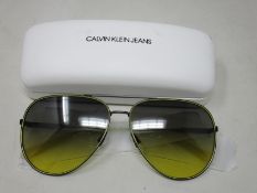 A pair of as new Calvin Klein sunglasses.