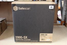 A boxed as new Safescan 2995-SX banknote value counter and fitness sorter.