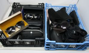 Twenty two pairs of designer sunglasses.