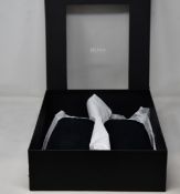 Four pairs of as new Hugo Boss slippers (2 x UK 7, UK 8, UK 9).