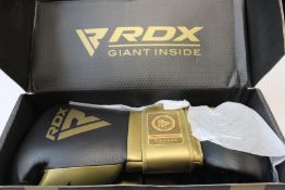 A pair of boxed as new RDX BGM Pro sparring boxing gloves.