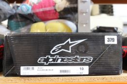 A pair of Alpinestars Tech 7 motocross boots in black, orange, white and blue (Size US 10 / EU 44.