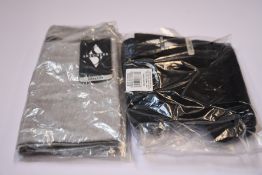 A quantity of assorted as new Skechers socks (3 pair packs and 6 pair packs, two jackets, three T-